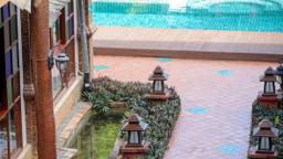 Pool terrace and garden walkway with Lanna lanterns at Jintara Rehab in Chiang Mai