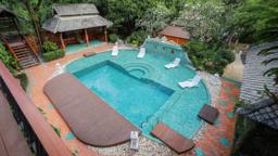 Elevated view over a mosaic pool, timber sala and tropical gardens at a Chiang Mai rehab