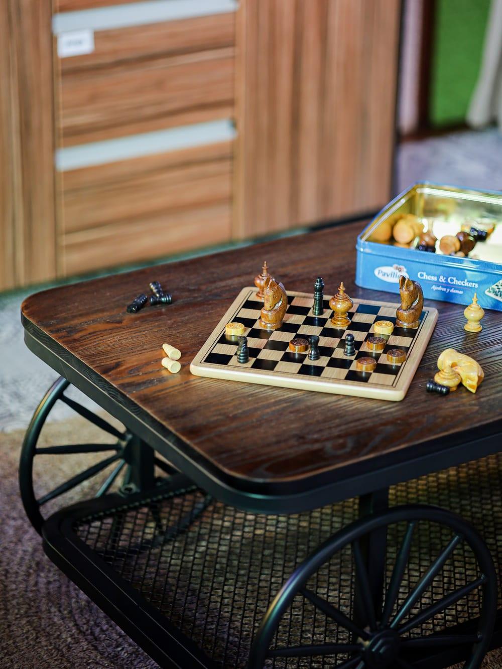 A chess and checkers set mid-game on a table in a warm common room at Jintara Rehab in Chiang Mai