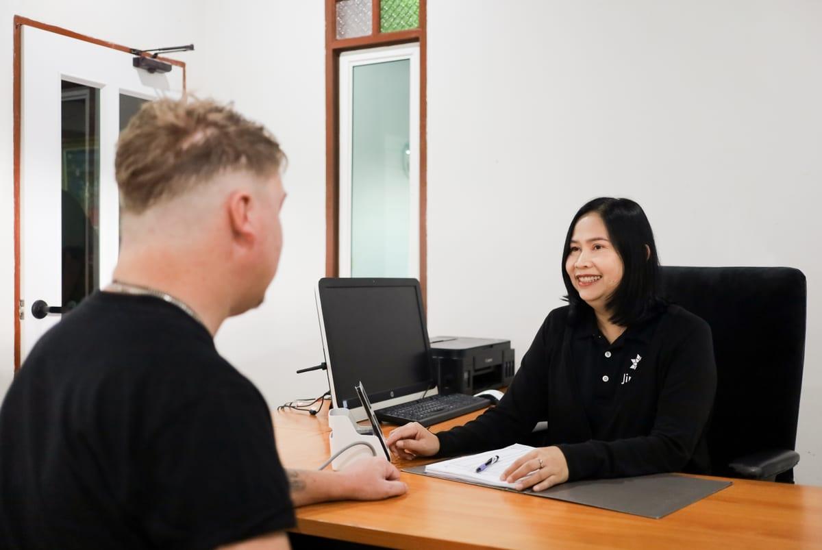 An admissions consultation between a staff member and a client at Jintara Rehab in Chiang Mai