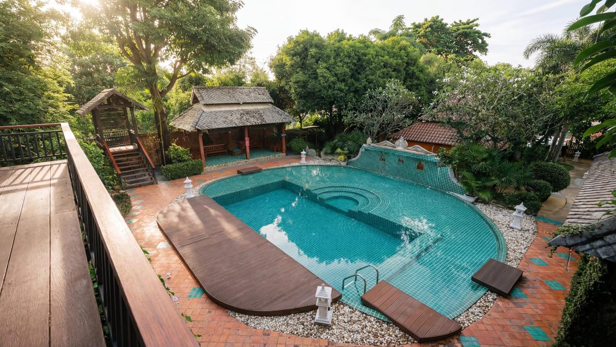 Jintara Rehab pool and grounds viewed from above in bright daytime, residential addiction treatment for professionals in Chiang Mai Thailand