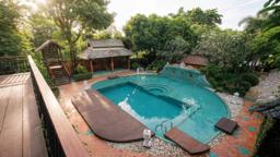 Jintara Rehab pool and grounds viewed from above in bright daytime, residential addiction treatment for professionals in Chiang Mai Thailand