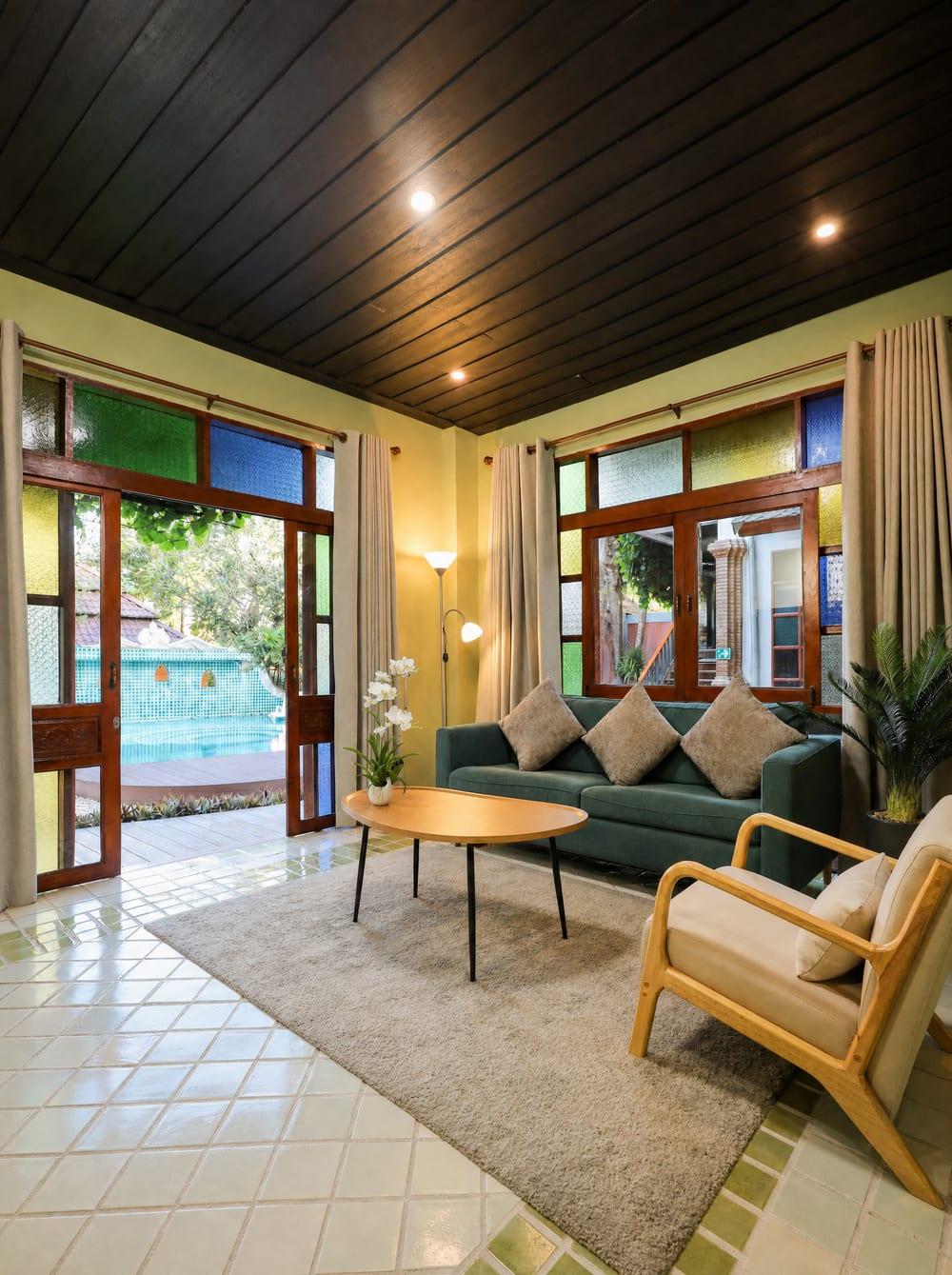 Private lounge with pool view at Jintara Rehab, where families receive structured support materials and discharge planning guidance