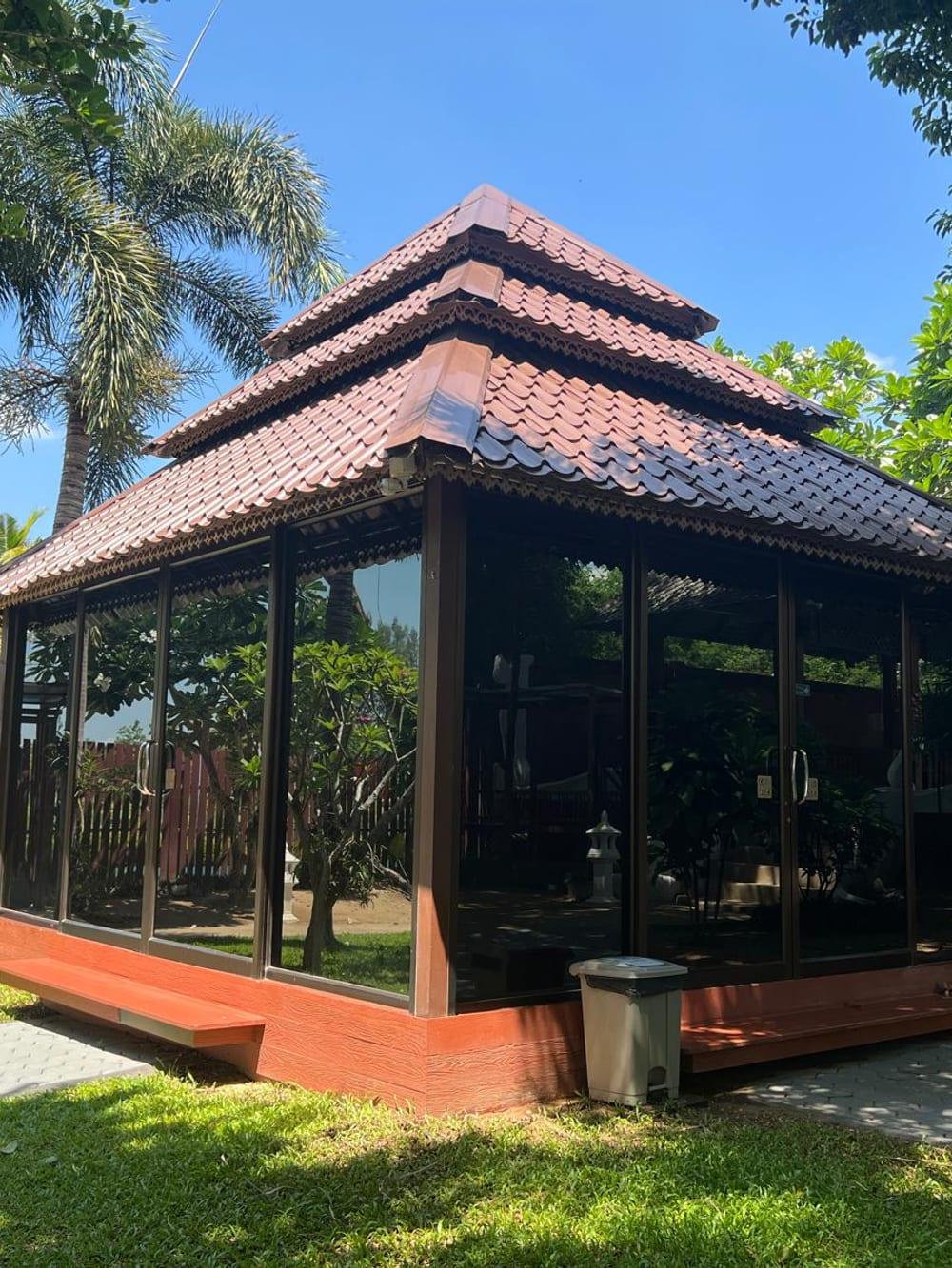 Glass sala pavilion at Jintara Rehab Chiang Mai used for CBT and EMDR therapy sessions