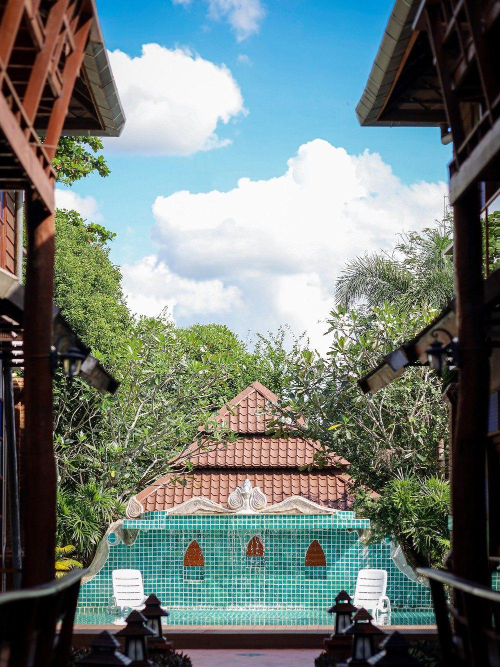 Covered brick walkway between buildings at Jintara Rehab in Chiang Mai, Thailand