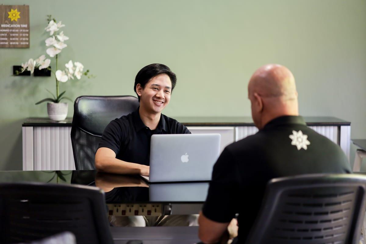 Clinician reviewing validated assessment results with a client at Jintara Rehab in Chiang Mai