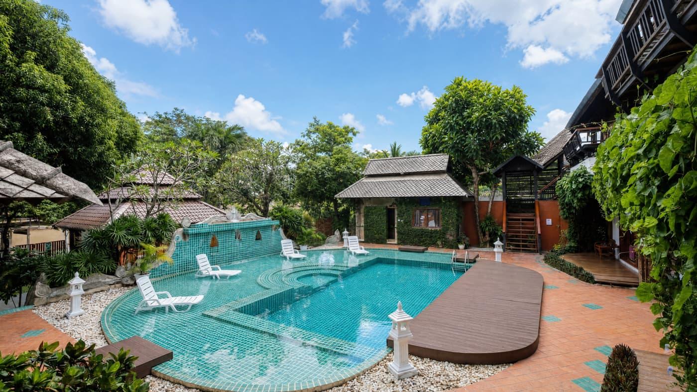 Outdoor pool and compound buildings at Jintara Rehab in Chiang Mai, Thailand