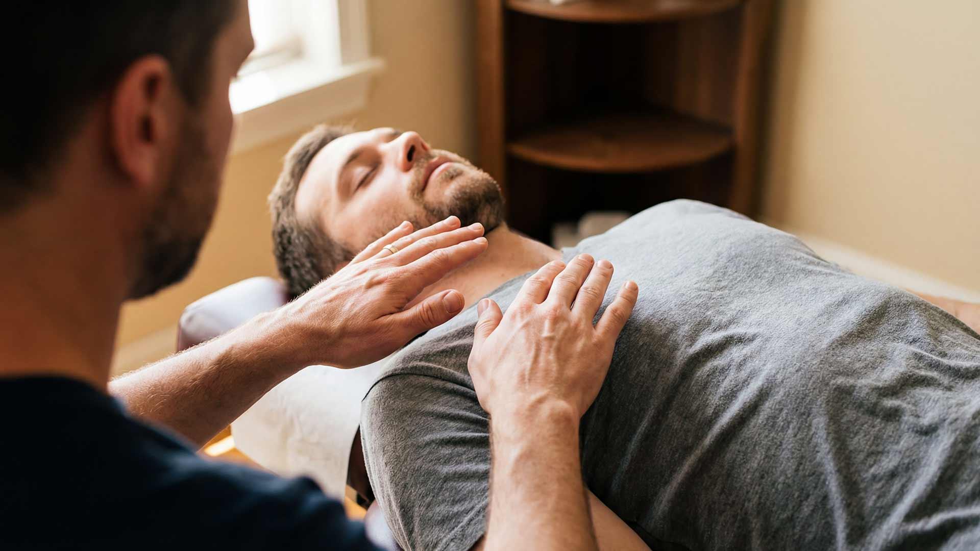 Close-up of a Reiki session at Jintara Rehab in Chiang Mai