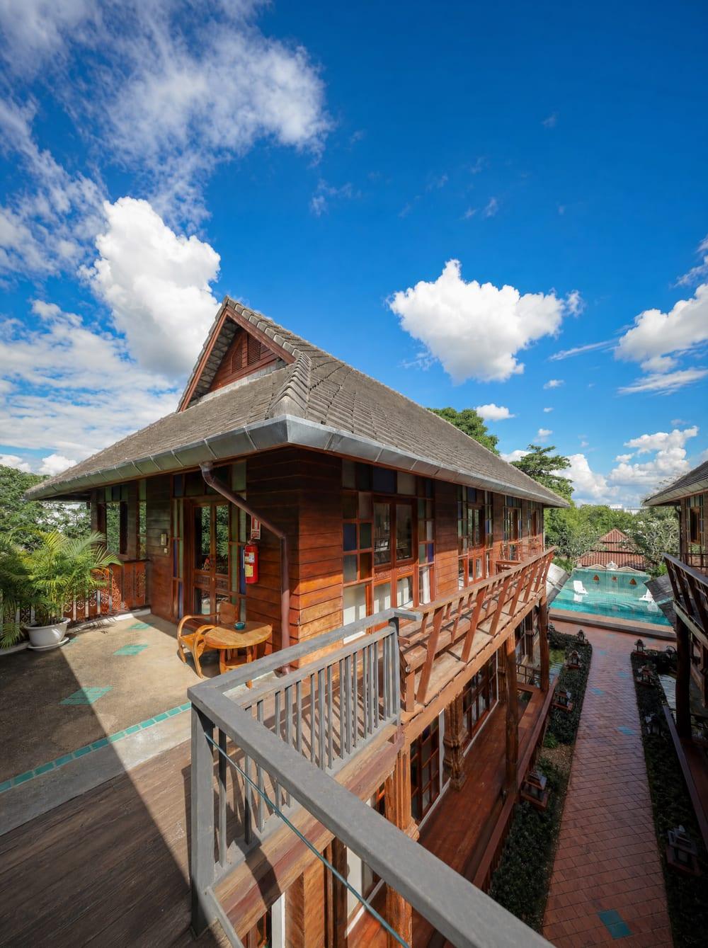 Teak building and pool at Jintara Rehab addiction treatment centre Chiang Mai Thailand