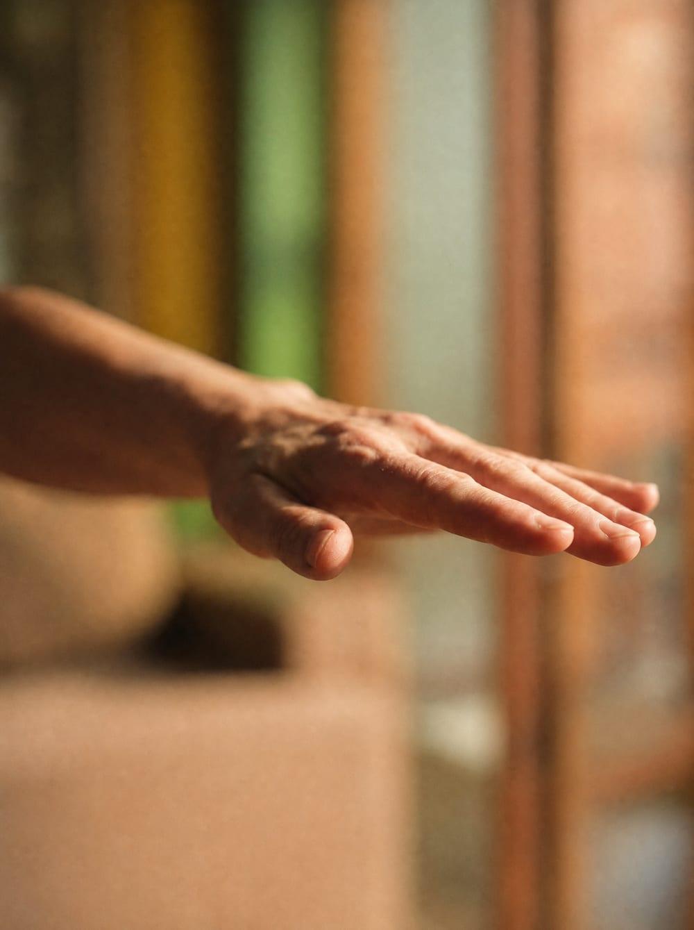 Hand during EMDR bilateral stimulation therapy for kratom addiction treatment Chiang Mai Thailand