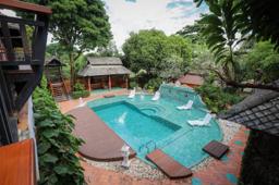 Jintara Rehab pool courtyard viewed from above in bright daytime, Chiang Mai Thailand addiction treatment facility