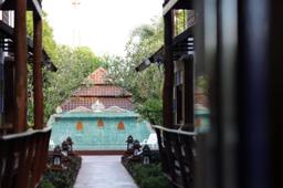 Lantern-lined walkway leading to the pool at Jintara boutique rehab compound, Chiang Mai Thailand