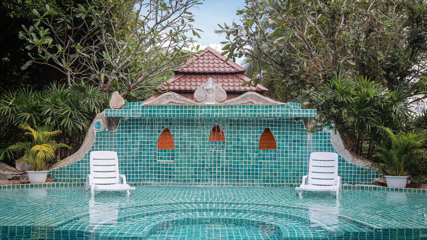 Pool and tiled pavilion with sun loungers at Jintara Rehab in Chiang Mai