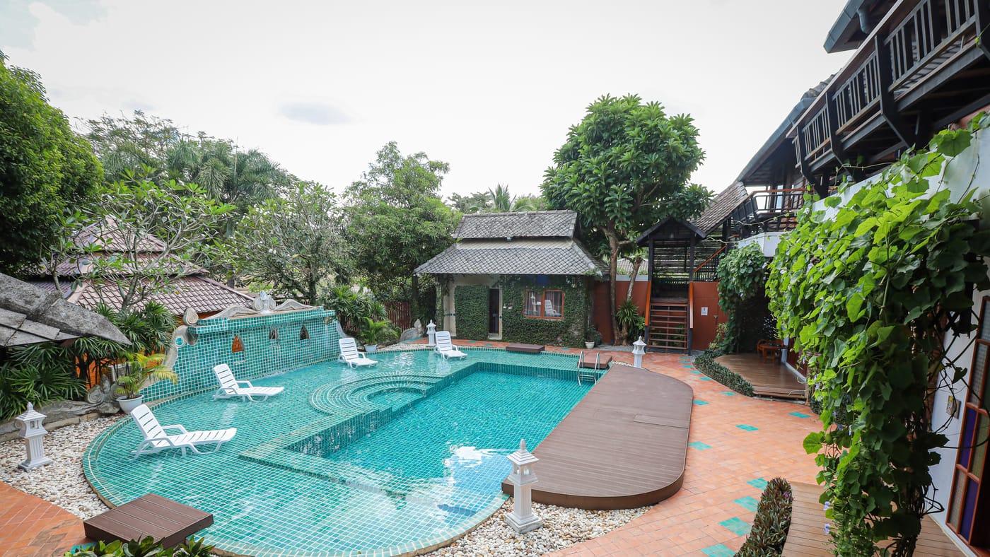 The pool and garden salas in daylight at Jintara Rehab in Chiang Mai