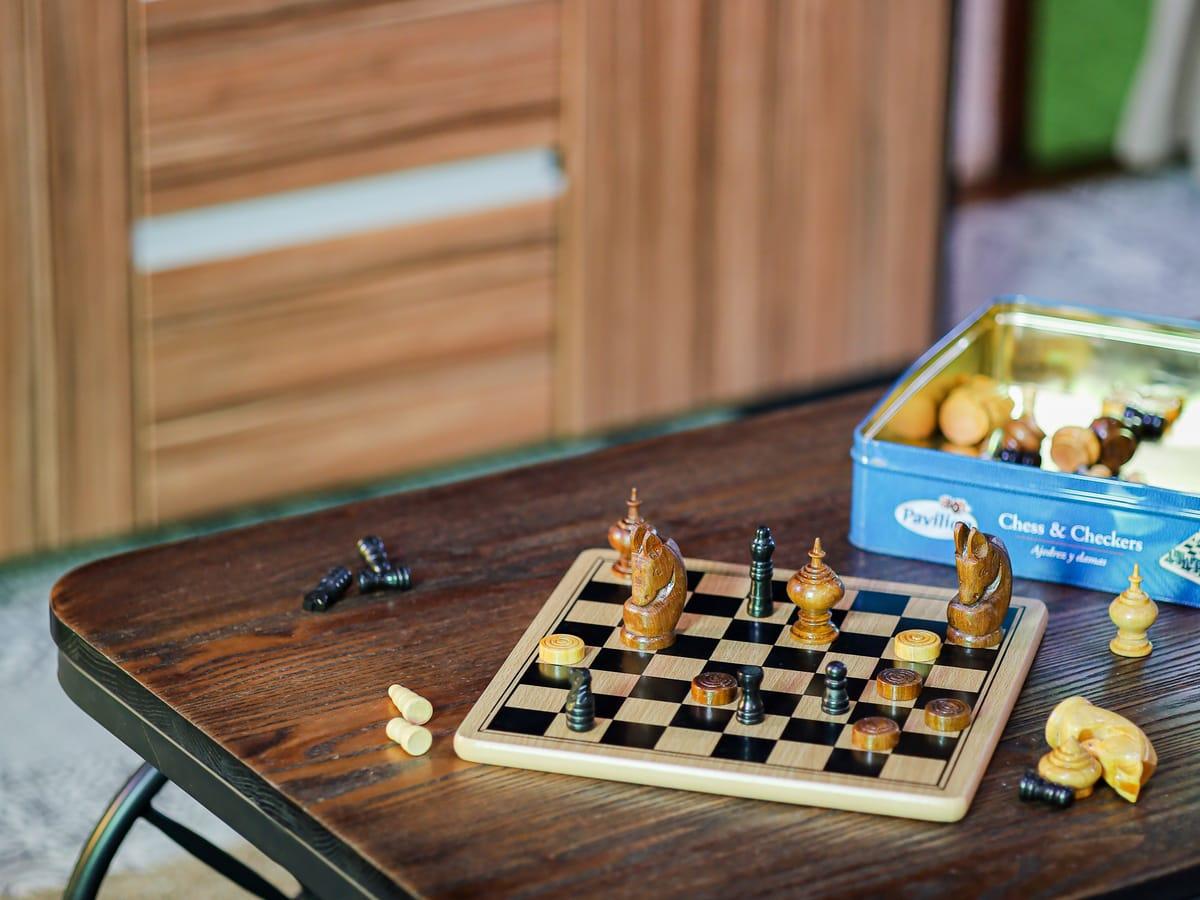 A chess set on a wooden table in a lounge at Jintara Rehab in Chiang Mai