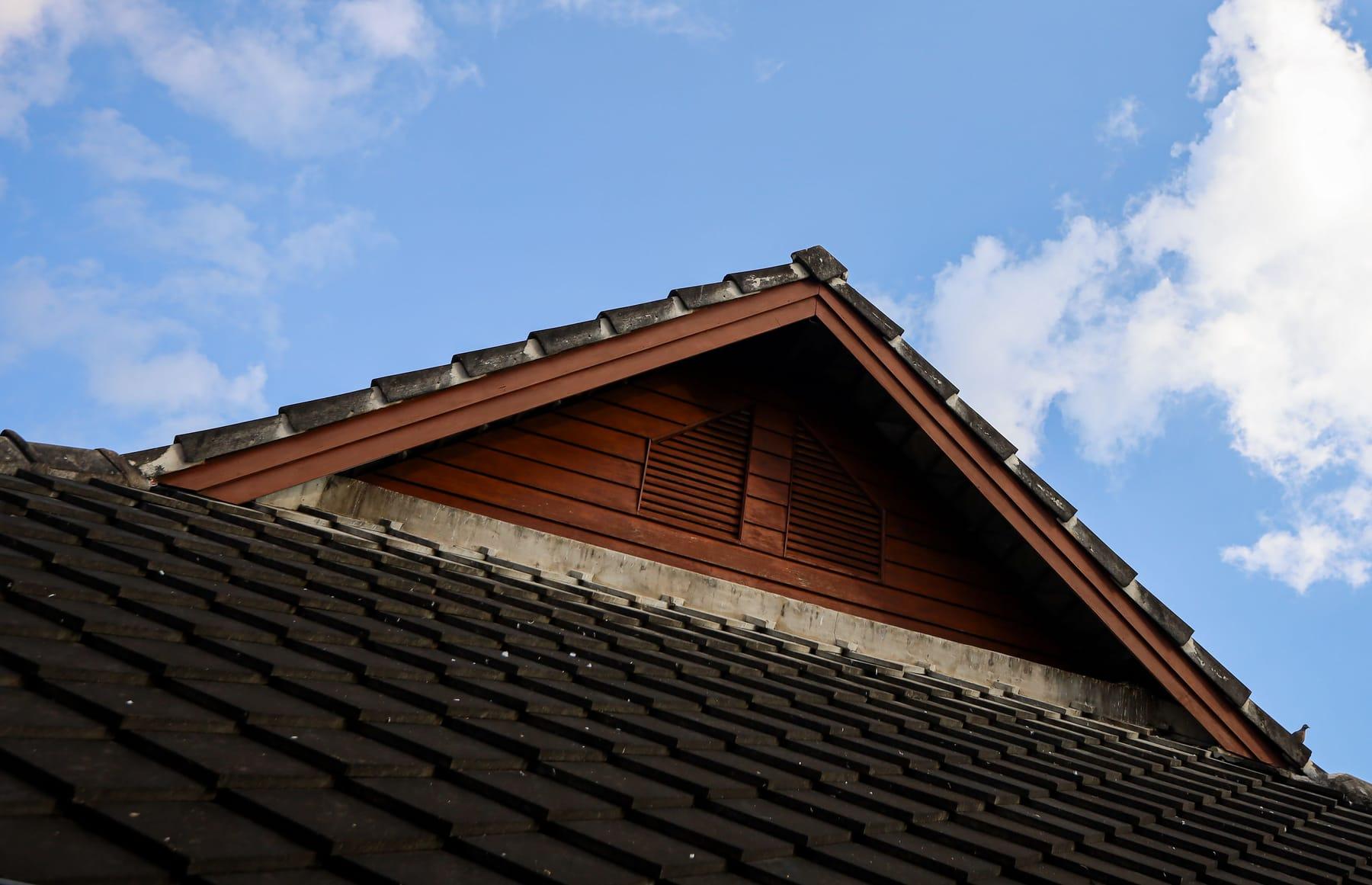 A teak roof against a blue sky at Jintara Rehab in Chiang Mai