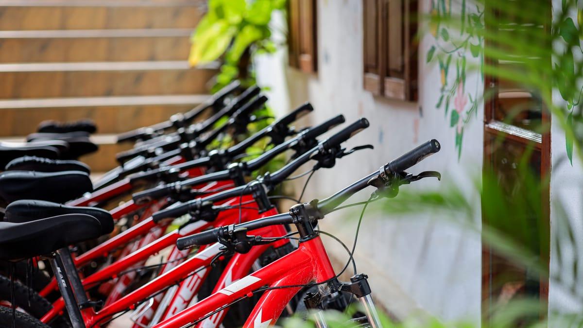 A row of bicycles parked by a stairway at Jintara Rehab in Chiang Mai