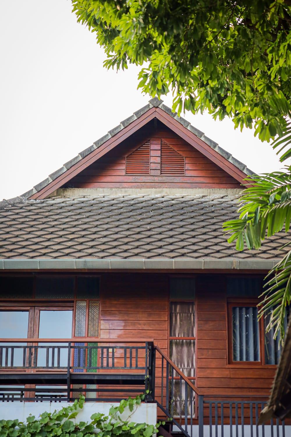 A two-storey teak building with a balcony at Jintara Rehab in Chiang Mai