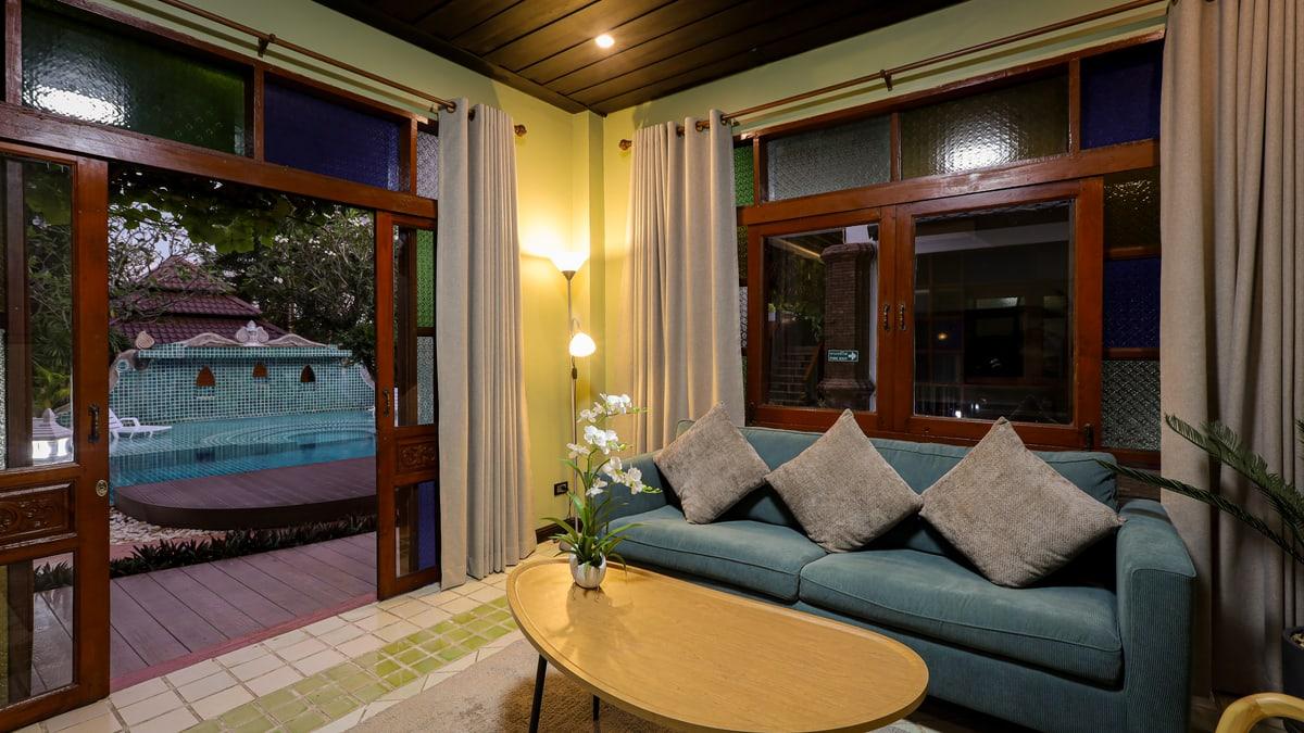 The lounge at Jintara Rehab in Chiang Mai looking out through the open doors to the pool