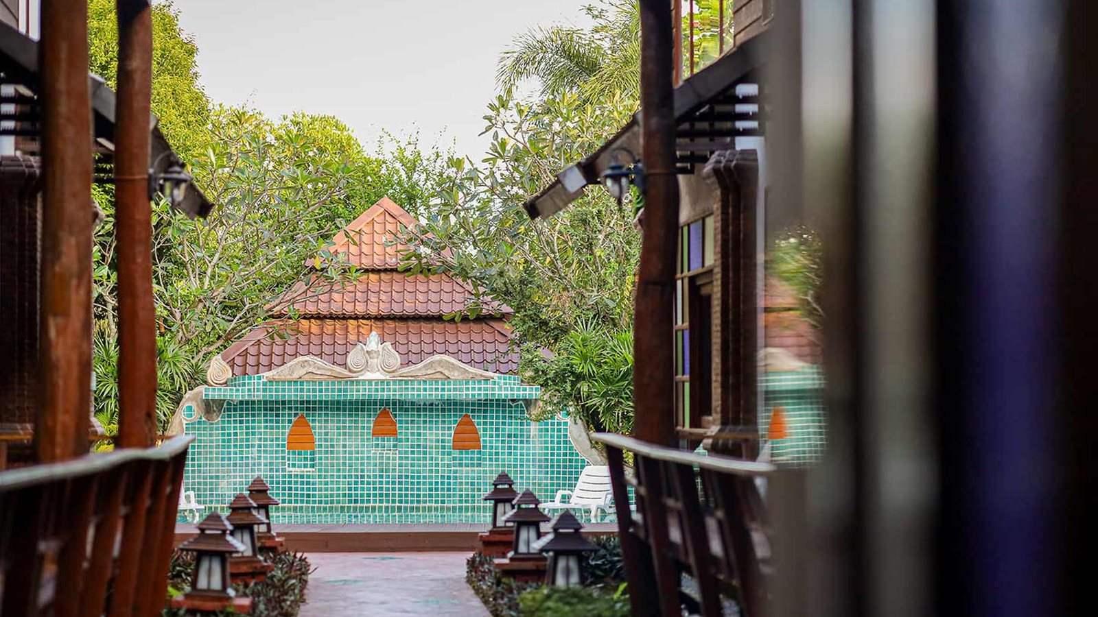 Lantern-lined walkway leading to the pool terrace at Jintara Rehab in Chiang Mai