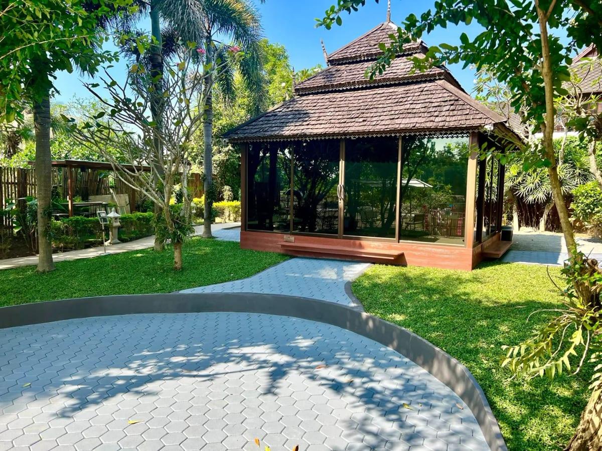 Thai wooden sala pavilion set in tropical garden grounds at Jintara Rehab Chiang Mai