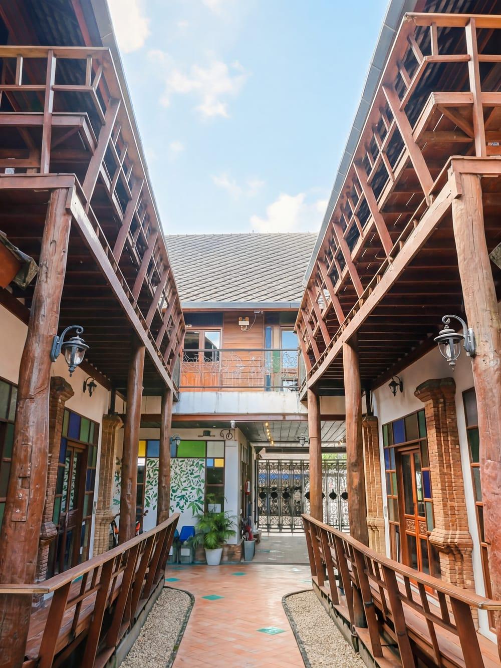 Compound courtyard with brick columns and Lanna architecture at Jintara Rehab Chiang Mai Thailand