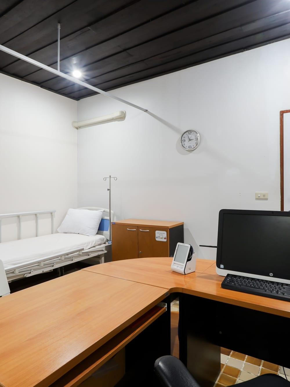Medical room with clinical bed and nursing workstation at Jintara Rehab Chiang Mai Thailand
