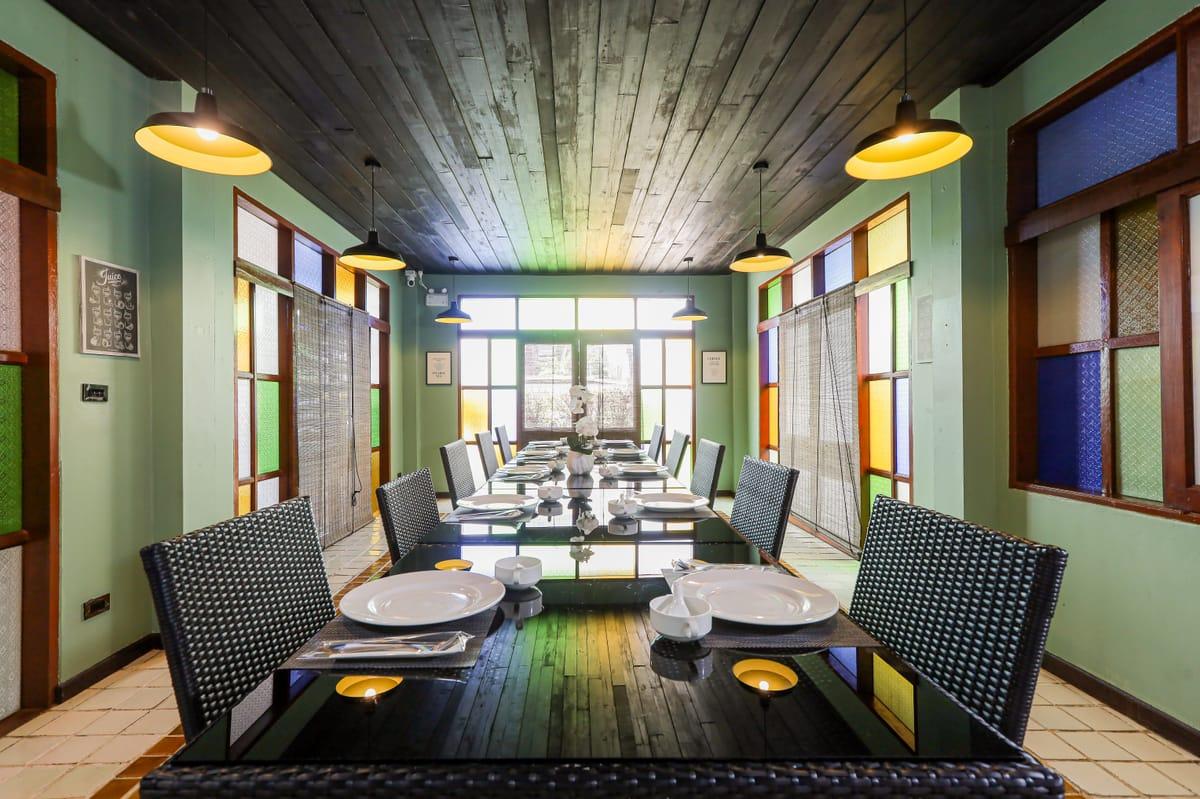 Wide view of the Jintara Rehab dining room in Chiang Mai, set for a residential meal