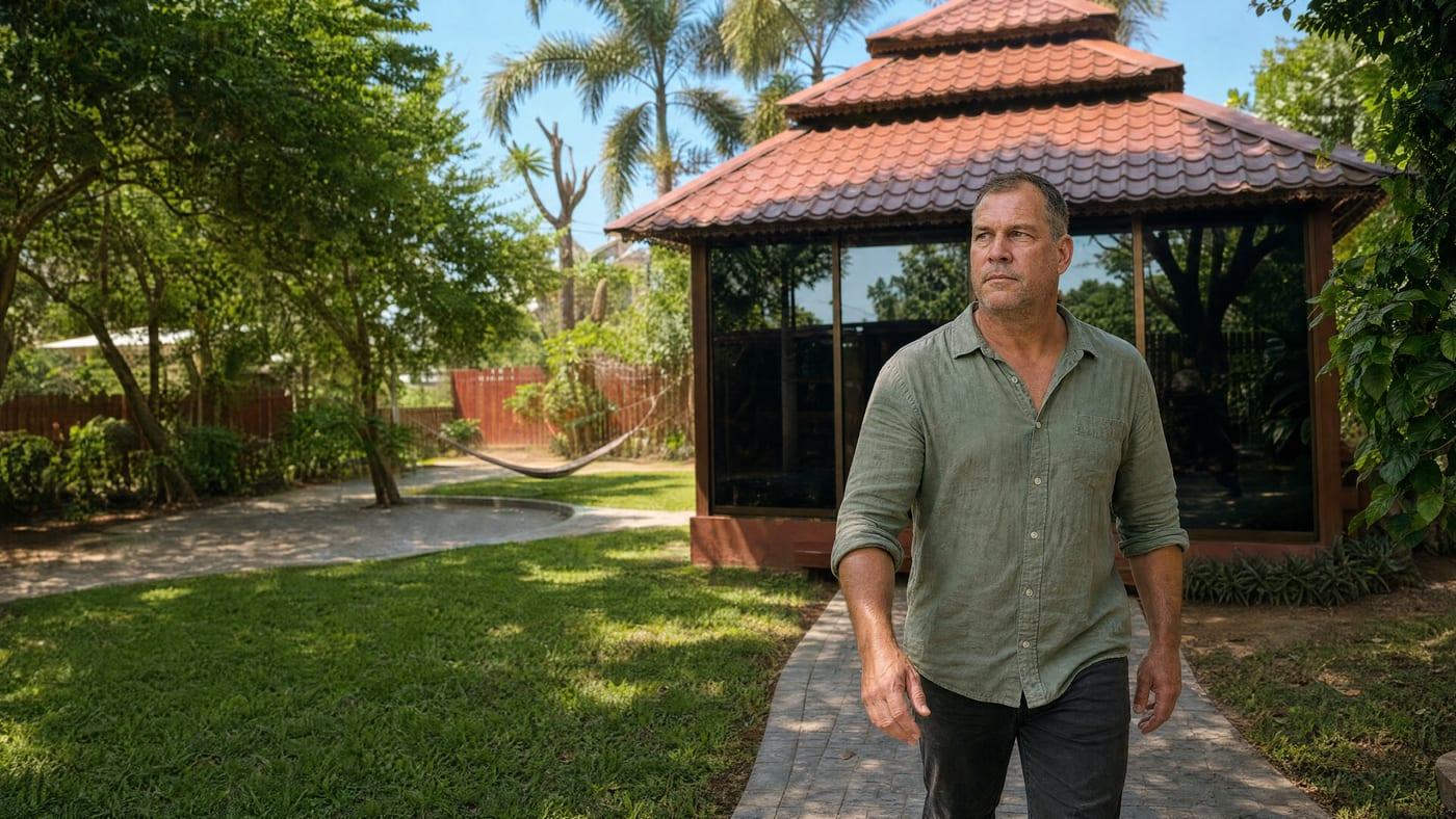 A man walks the garden path past the glass sala at Jintara Rehab in Chiang Mai, the Thailand facility Australian clients travel to