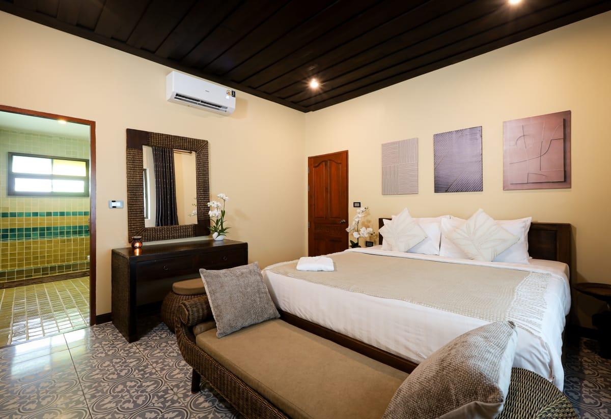 Warm private bedroom with king bed at Jintara Rehab in Chiang Mai