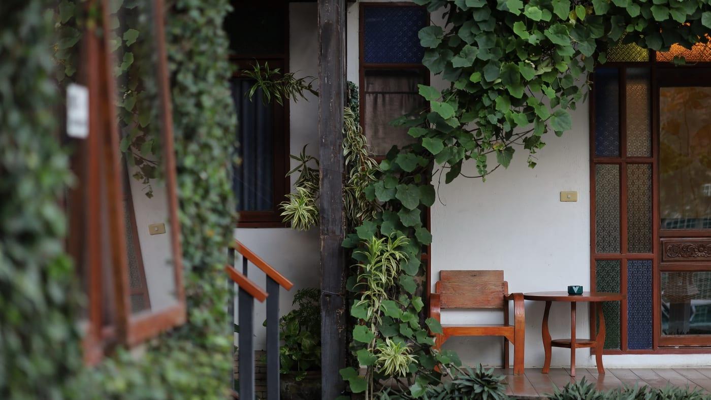 Quiet timber porch and garden bench at a benzodiazepine rehab in Chiang Mai Thailand