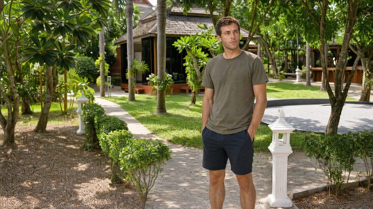 A client in a reflective moment in the garden at Jintara Rehab Chiang Mai during his individual therapy work
