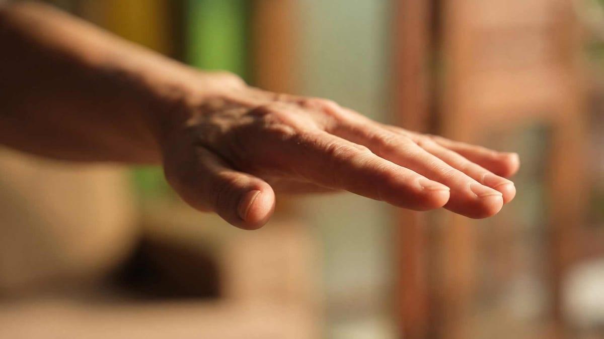 Close-up of an open hand extended in warm natural light representing EMDR therapy at Jintara Rehab