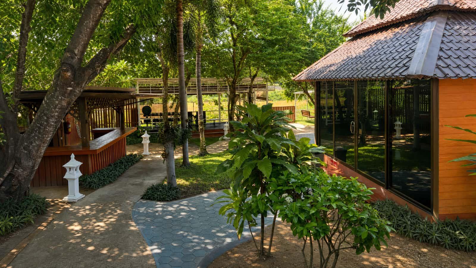 Tropical garden and glass sala pavilion at Jintara Rehab residential treatment facility Chiang Mai