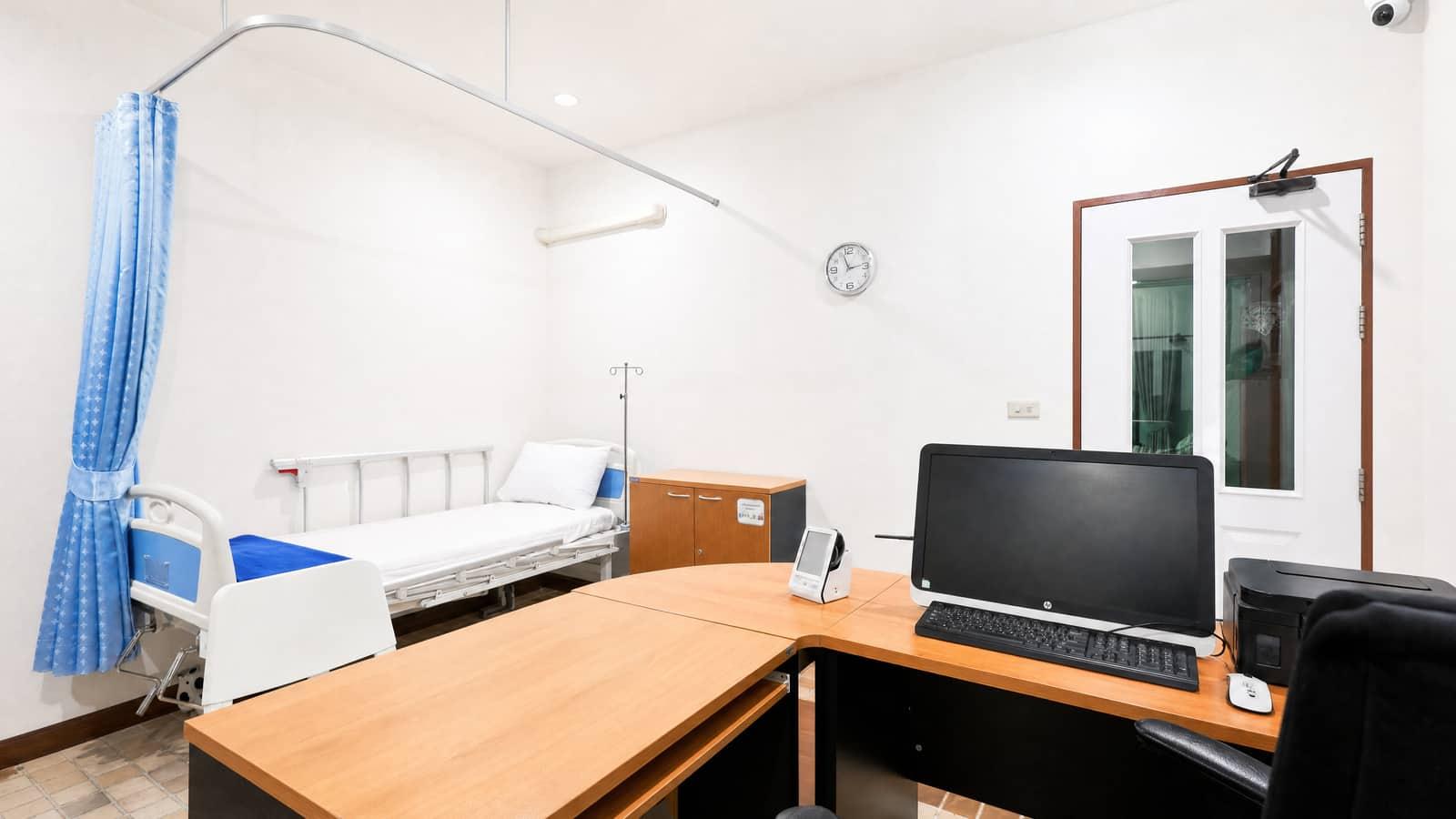 Clinical medical room with hospital bed and doctor workstation at Jintara Rehab Chiang Mai detox facility
