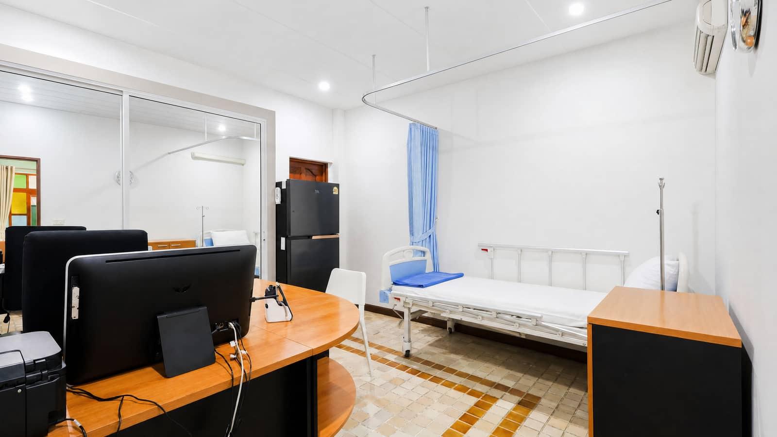 Medical room with hospital bed and workstations at Jintara Rehab addiction treatment facility Chiang Mai