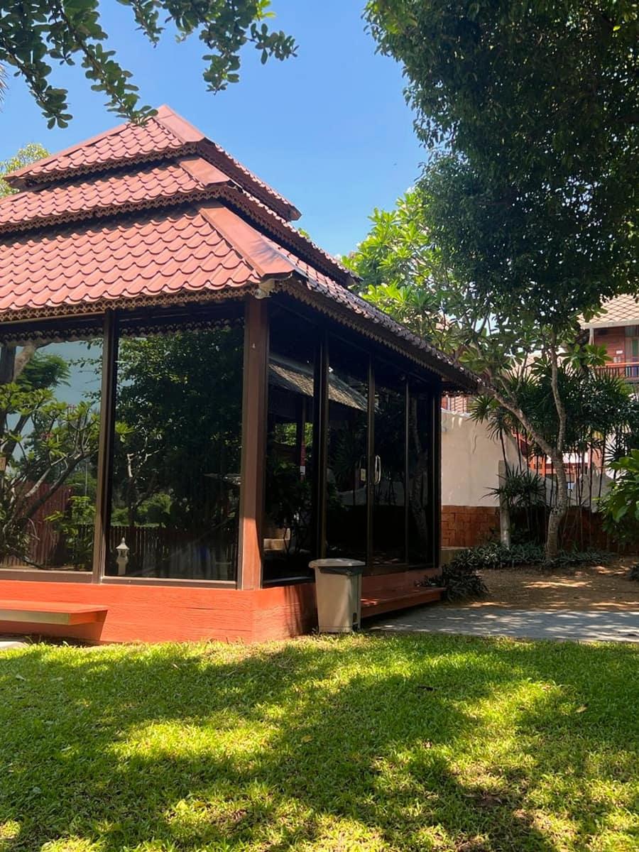 Lanna garden sala among tropical trees at Jintara Rehab in Chiang Mai, Thailand
