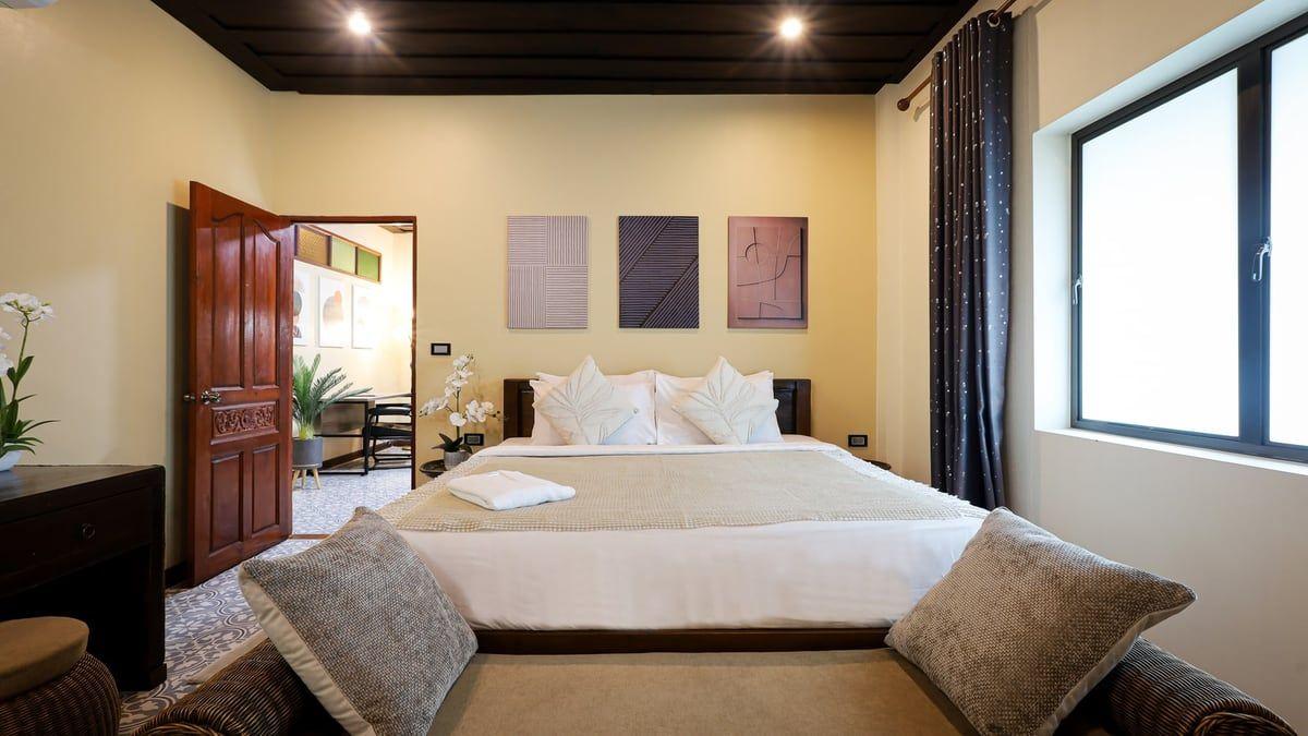 Warm private bedroom with soft daylight at Jintara Rehab in Chiang Mai