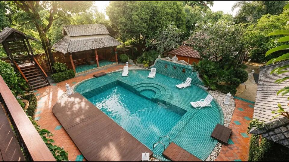 The Jintara pool and gardens seen from the upper balcony on a quiet morning during the first week of treatment.