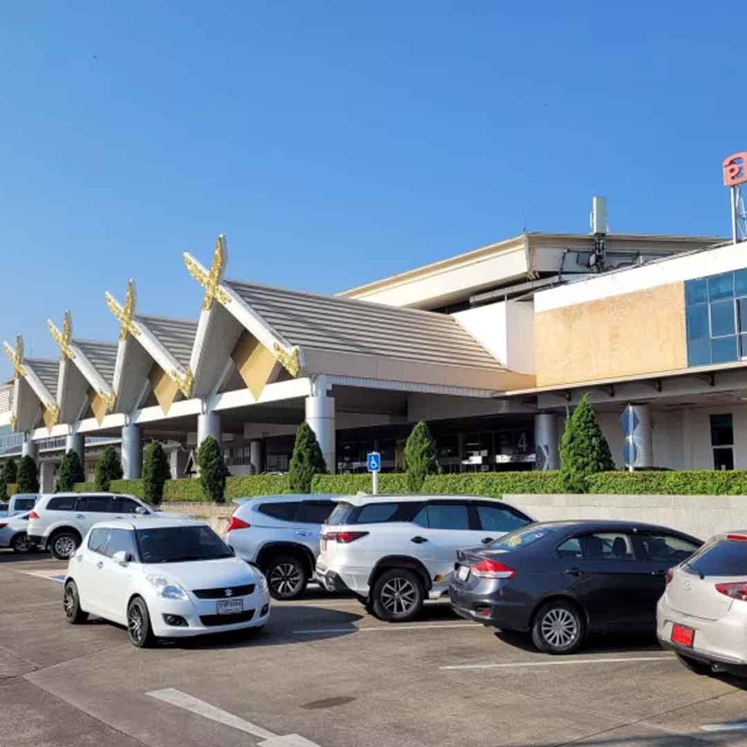 Chiang Mai International Airport exterior with Lanna-inspired roof and blue sky