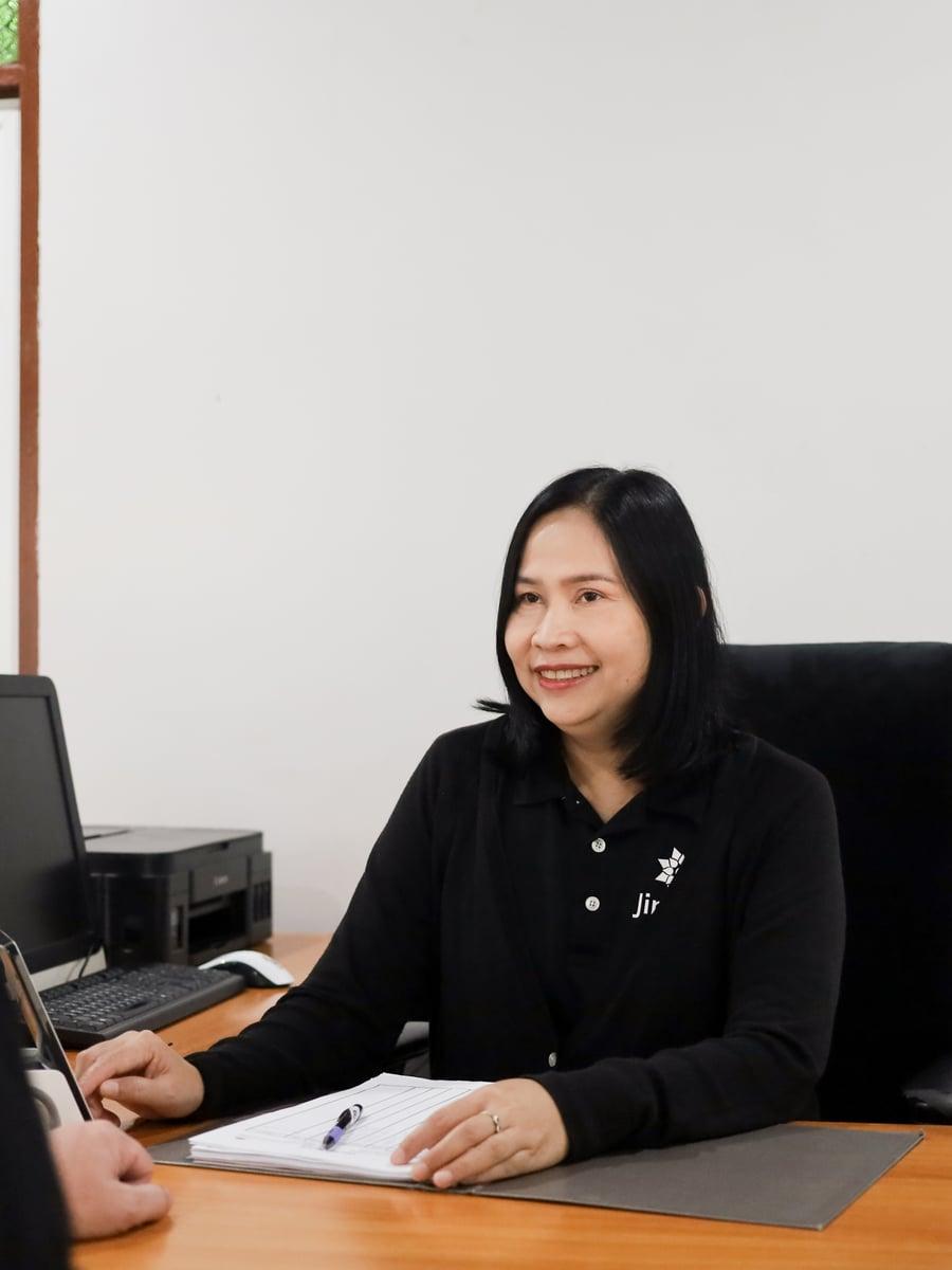 Jintara clinical nurse at consultation desk during heroin addiction admission assessment in Chiang Mai