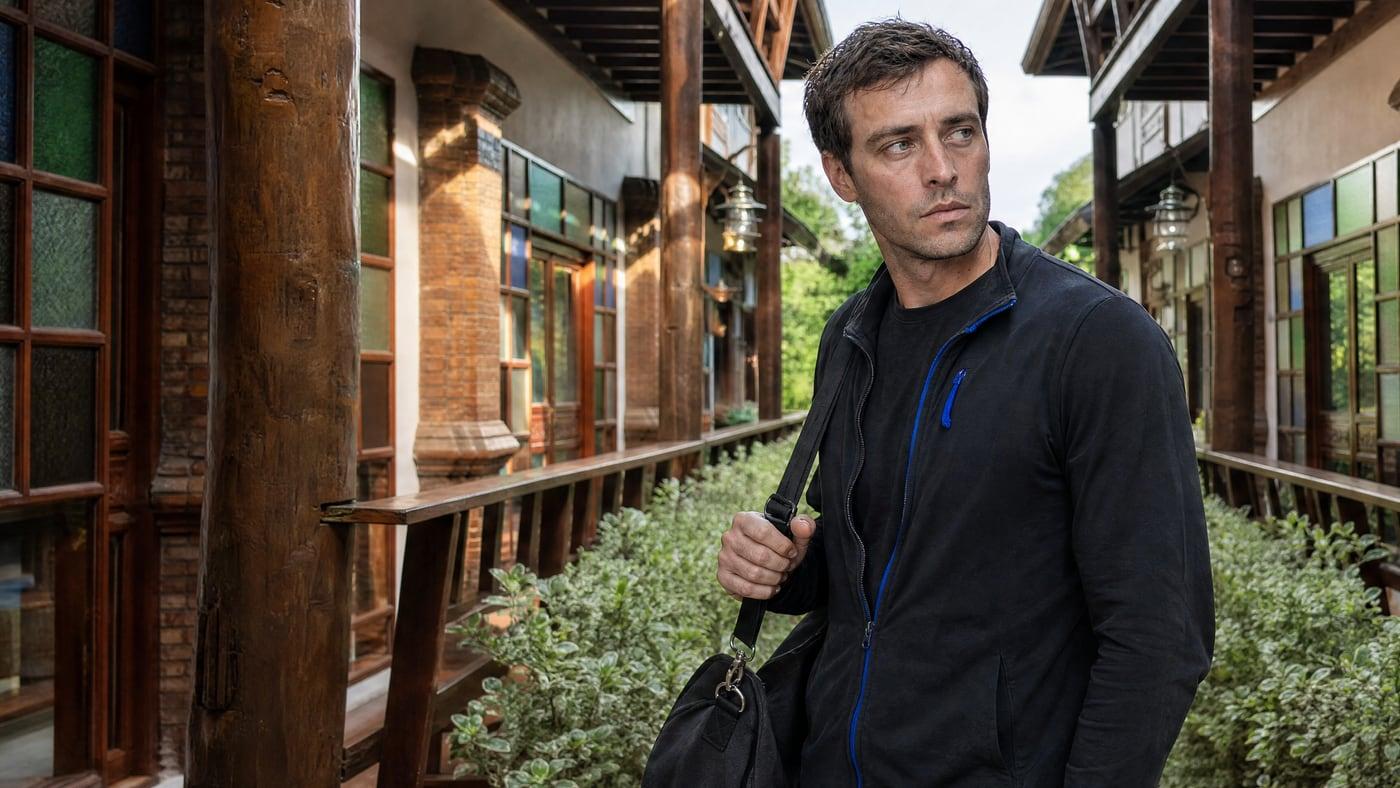 A man arrives with his bag on the guest room walkway at Jintara Rehab in Chiang Mai, Thailand, at the start of residential treatment for cocaine use disorder