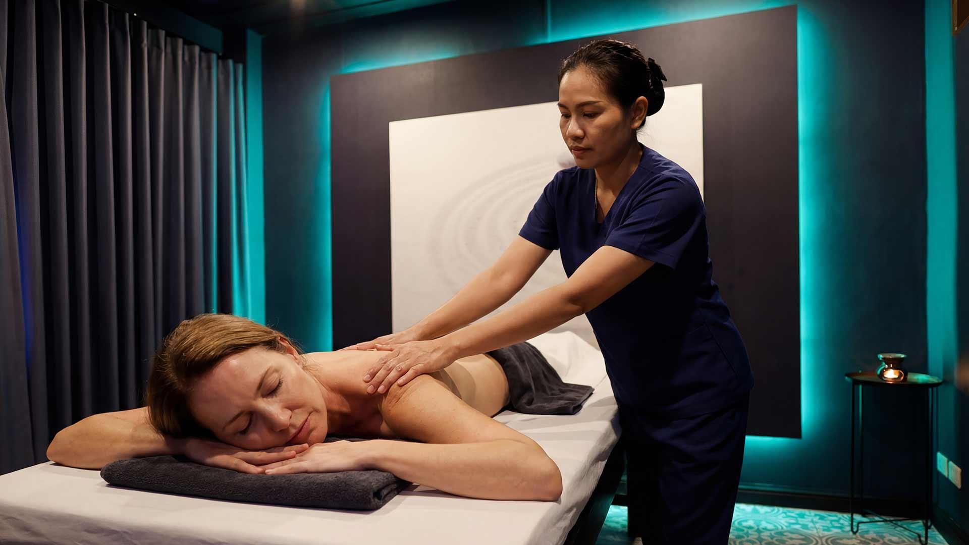 Therapeutic Thai massage session in the treatment room at Jintara Rehab Chiang Mai