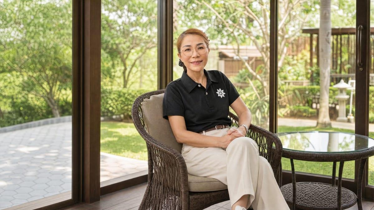 A Jintara nurse seated in the garden lounge at Jintara Rehab in Chiang Mai Thailand