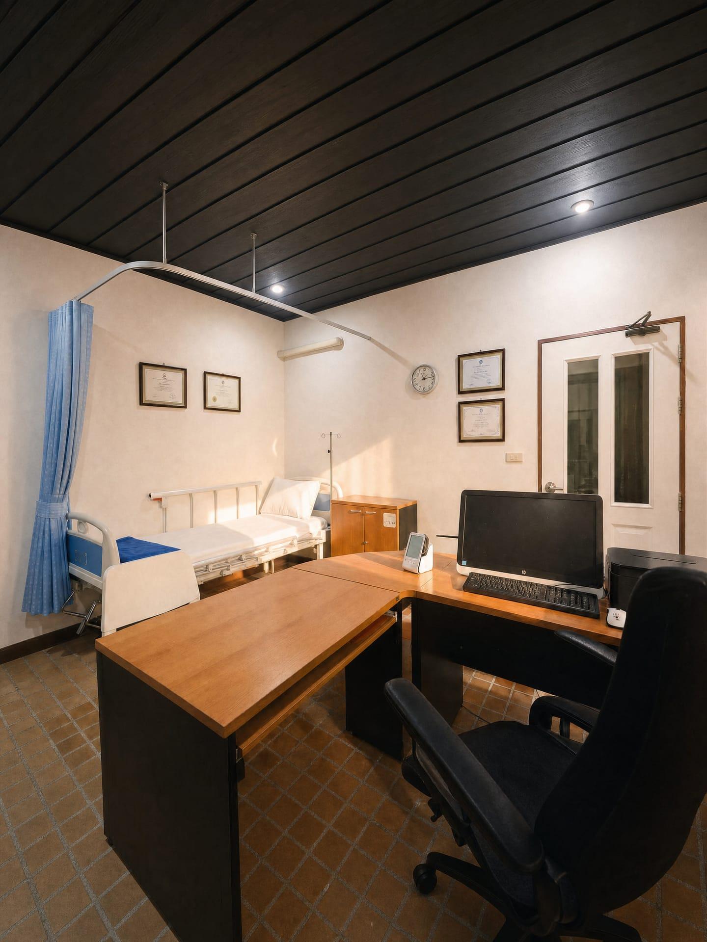 The on-site medical room at Jintara Rehab with a hospital bed, privacy curtain and clinical desk