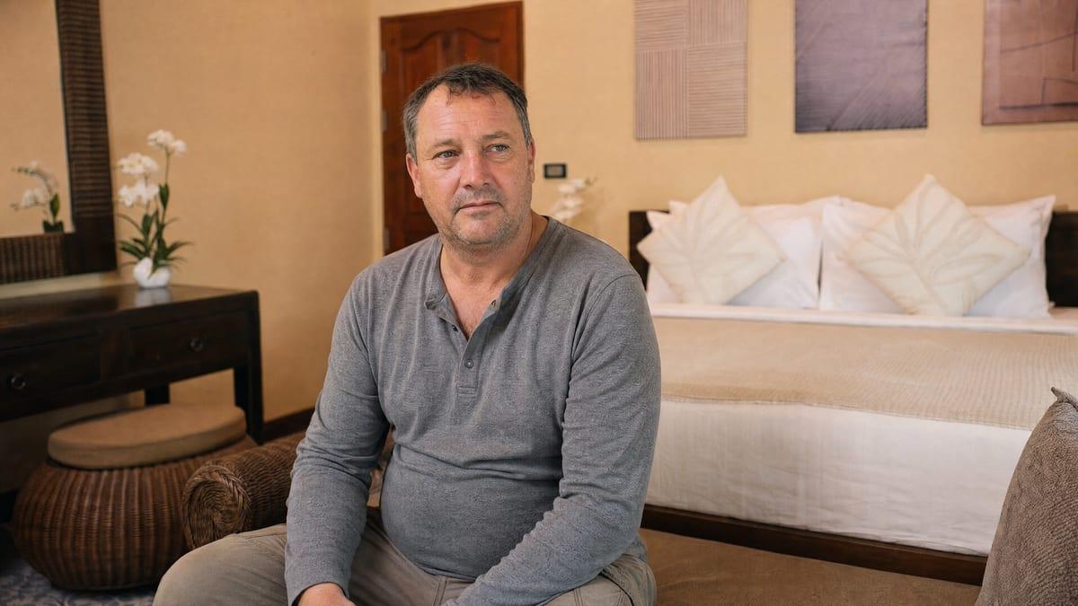 A man resting quietly in a private room during medically supervised detox at Jintara Rehab in Chiang Mai