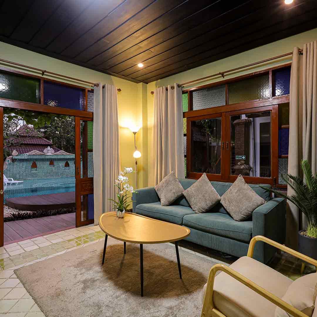 Private lounge with warm lighting and pool view at Jintara Rehab Chiang Mai