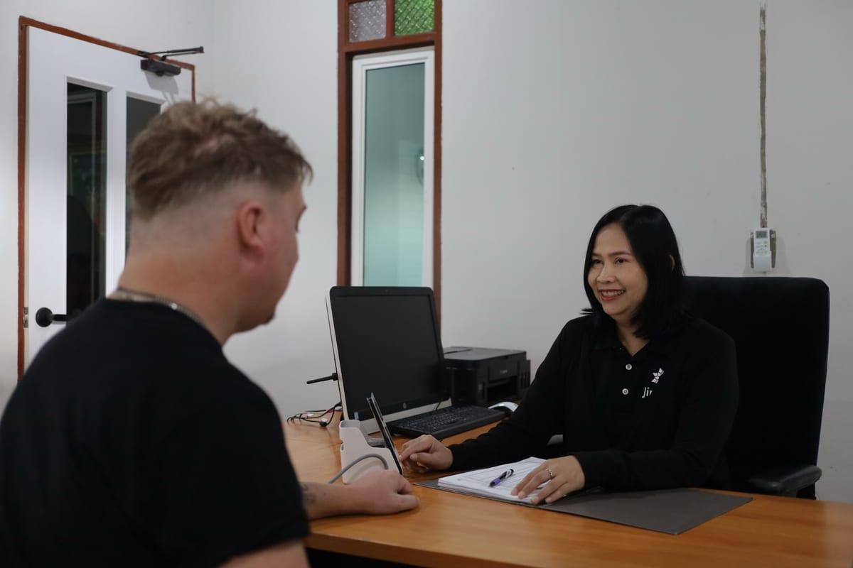 Jintara clinical nurse conducting a structured psychiatric assessment on arrival