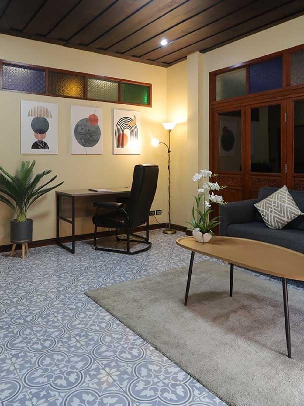 Warm residential lounge with soft seating at Jintara Rehab Chiang Mai Thailand