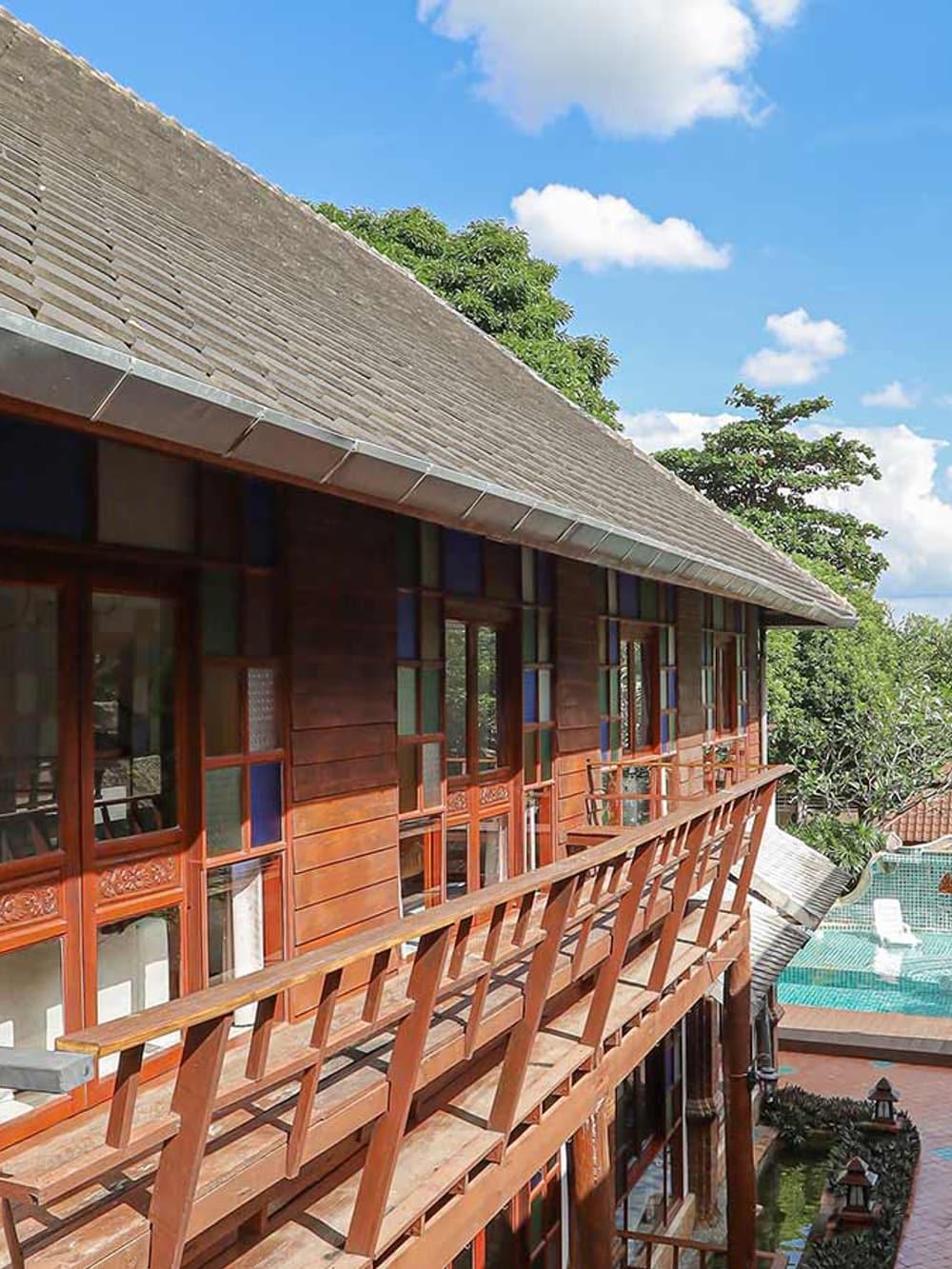 Lanna building veranda overlooking the pool at Jintara Rehab Chiang Mai Thailand